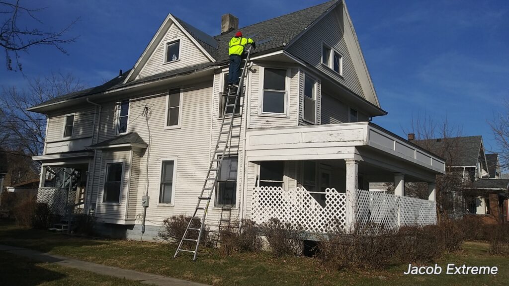 Roofing contractor working on a residential roof
